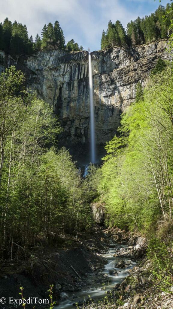 The waterfall at the end of the valle in the Swiss Alps The waterfall at the end of the valle in the Swiss Alps